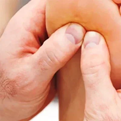 A practitioner performing ART on a patient's foot